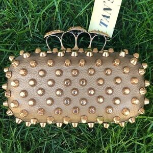 Skulls knuckles ring handles, rhinestone spikes studded clutch.